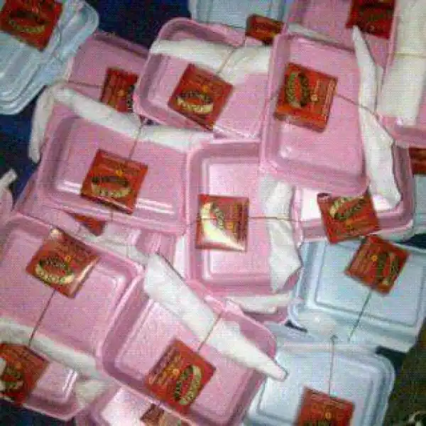 Nawa OO!! Couple Served Their Guests Food With Packet Of Condom At Their Wedding [See Photo]